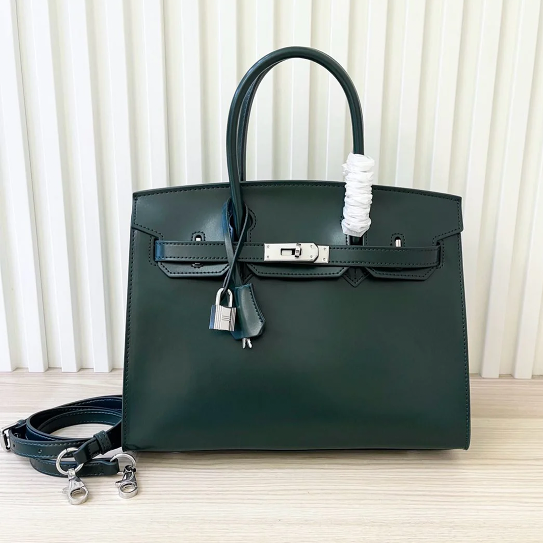 Deep Forest Cypress Green Smooth Polished Compact Angular Structured Hand Tote With Burgundy Zipper Lined Interior, Sleek Silvery Twist Lock Hardware And Coordinating Solid Tone Decorative Tag Etched Metal Padlock Charm